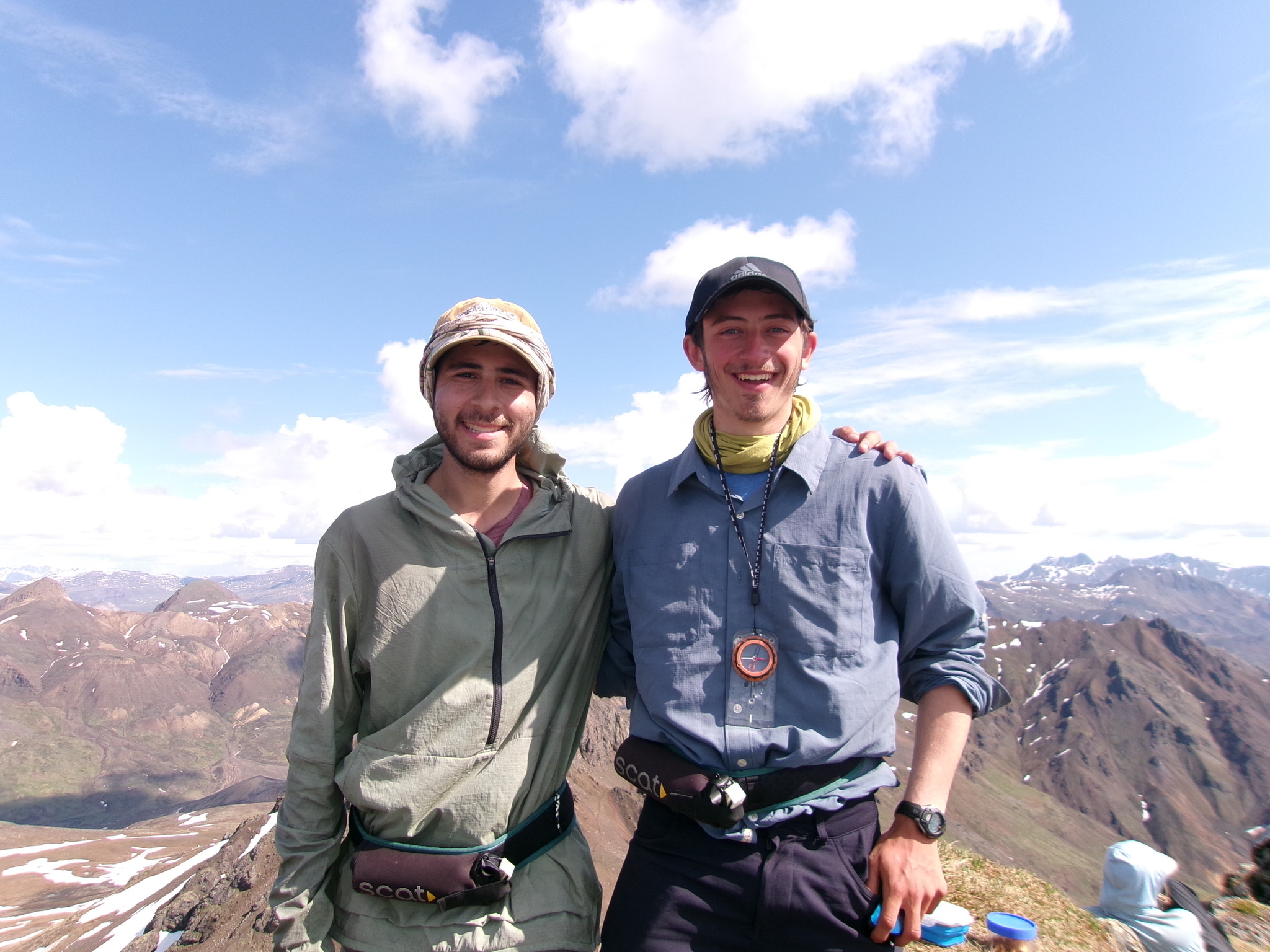 Dylan Satow and friend on a mountain top with scenic views